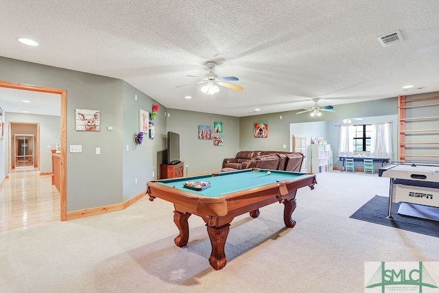 playroom with ceiling fan, a textured ceiling, light carpet, and billiards