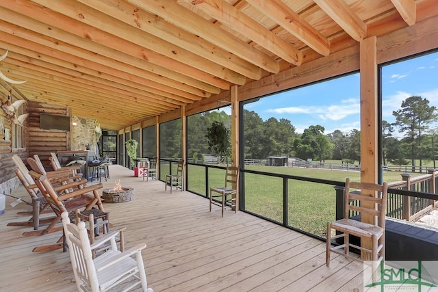 wooden terrace with a yard