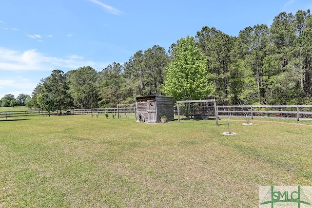 view of yard with a rural view