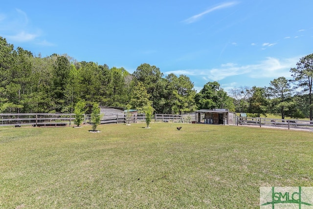 view of yard with a rural view