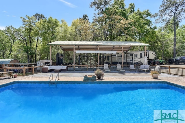 view of swimming pool with a patio area