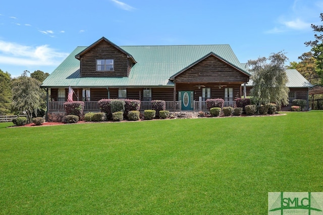 view of front of house with a porch and a front lawn