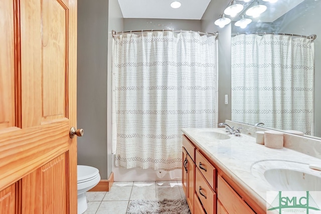 full bathroom with shower / tub combo with curtain, tile floors, toilet, and dual bowl vanity