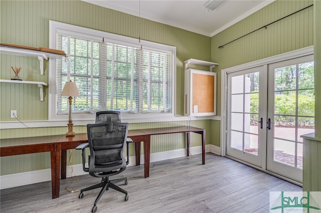 home office with french doors, light wood-type flooring, and ornamental molding