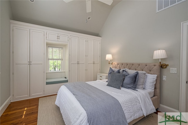 bedroom featuring ceiling fan, vaulted ceiling, and dark hardwood / wood-style flooring