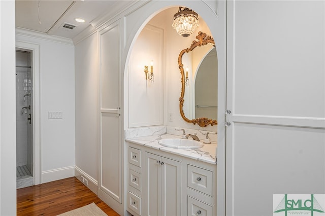 bathroom with hardwood / wood-style flooring and vanity