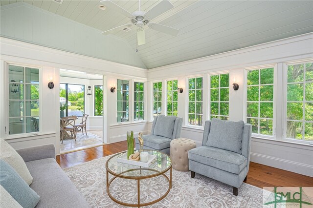 sunroom featuring vaulted ceiling and ceiling fan