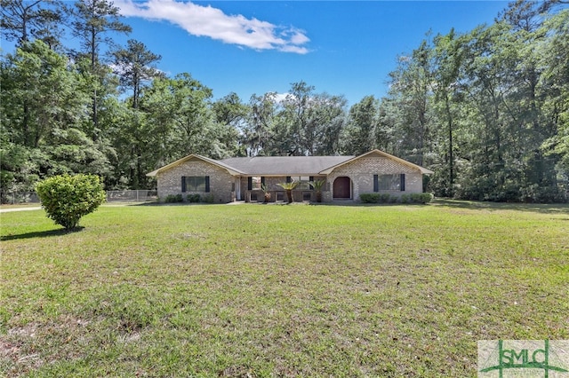 ranch-style house featuring a front lawn