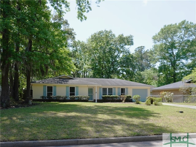 single story home with a front yard and a garage