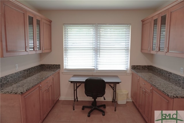 home office featuring light tile floors and a wealth of natural light