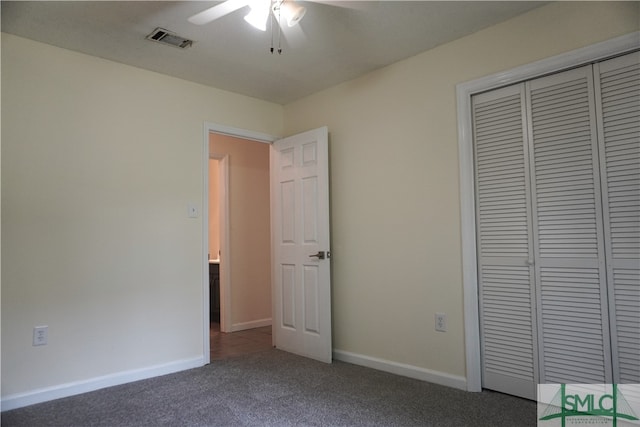 unfurnished bedroom featuring a closet, ceiling fan, and dark carpet