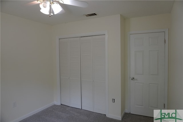 unfurnished bedroom featuring a closet, ceiling fan, and dark carpet