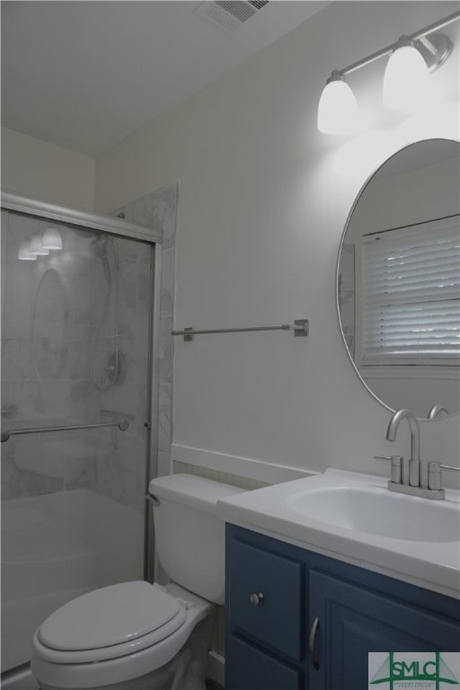 bathroom featuring oversized vanity and toilet