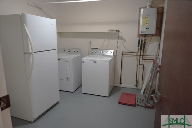 laundry area with water heater and separate washer and dryer