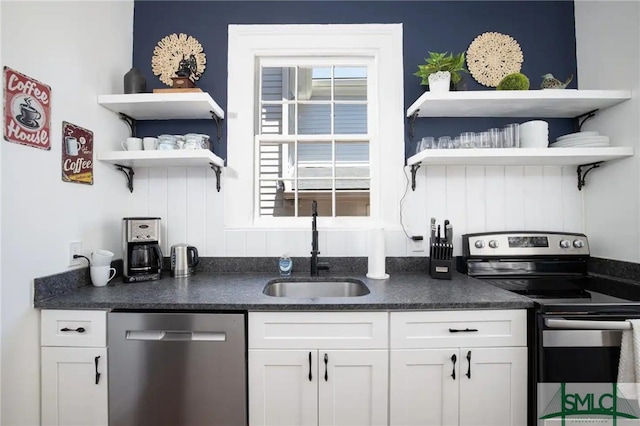 kitchen with white cabinetry, sink, and stainless steel appliances