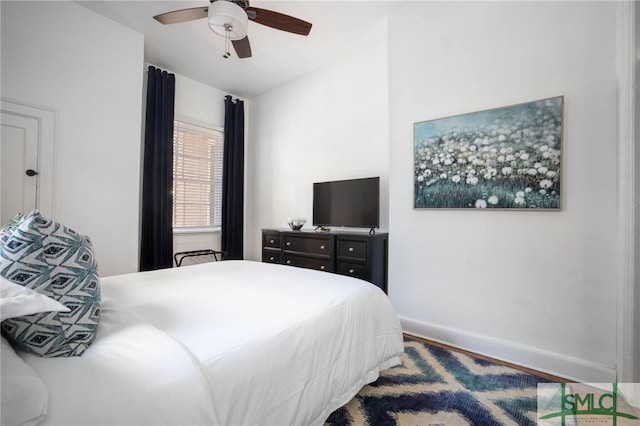 bedroom with wood-type flooring and ceiling fan