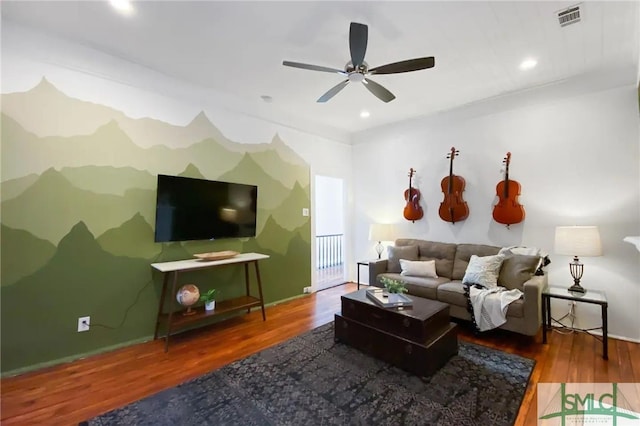 living room with hardwood / wood-style flooring and ceiling fan