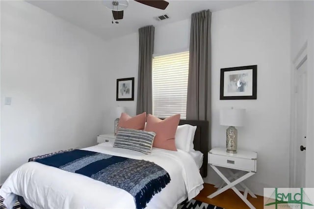 bedroom with ceiling fan and hardwood / wood-style floors