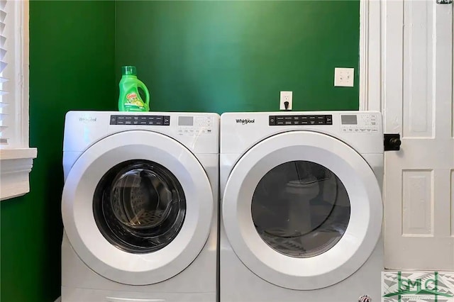 laundry room with washing machine and clothes dryer