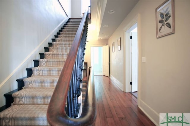 stairway featuring hardwood / wood-style floors