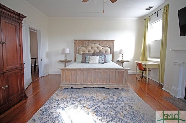 bedroom featuring ornamental molding, ceiling fan, and hardwood / wood-style floors