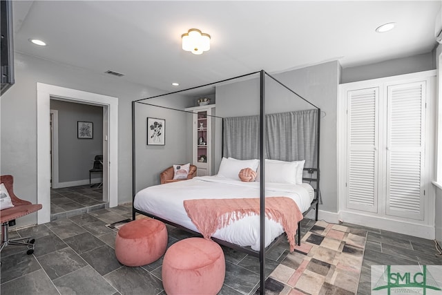 bedroom featuring dark tile flooring