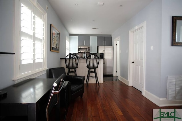 living area with hardwood / wood-style flooring