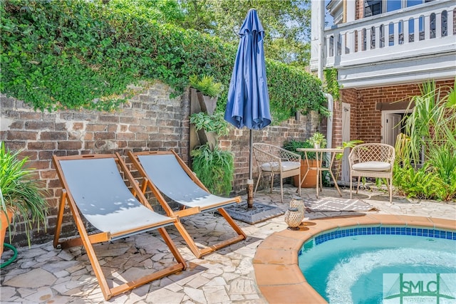 view of pool featuring a patio