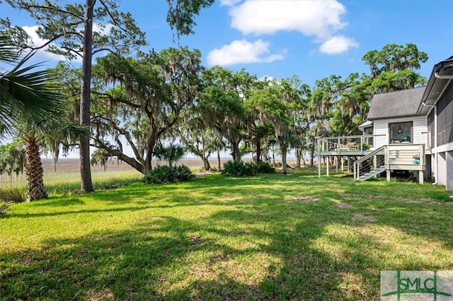 view of yard featuring a wooden deck