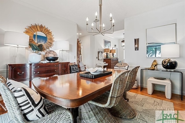 dining room with an inviting chandelier and light wood-type flooring