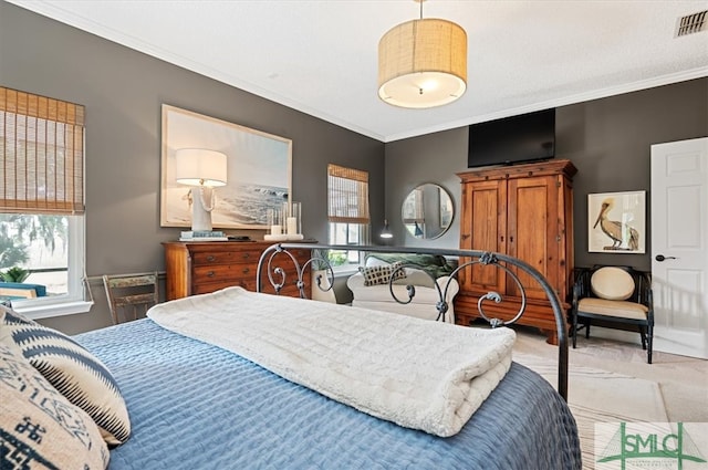 bedroom with light colored carpet, ornamental molding, and multiple windows