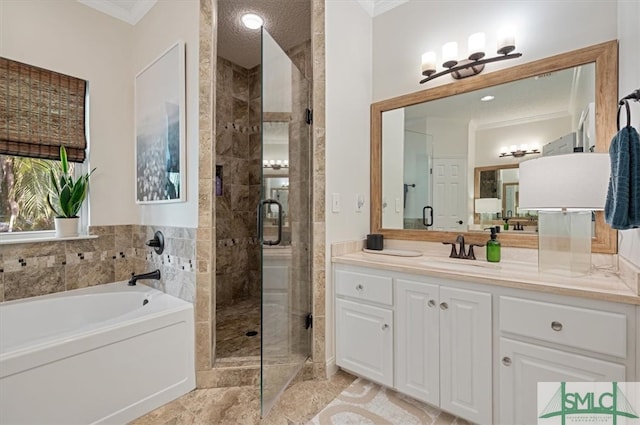 bathroom featuring ornamental molding, oversized vanity, shower with separate bathtub, and tile floors