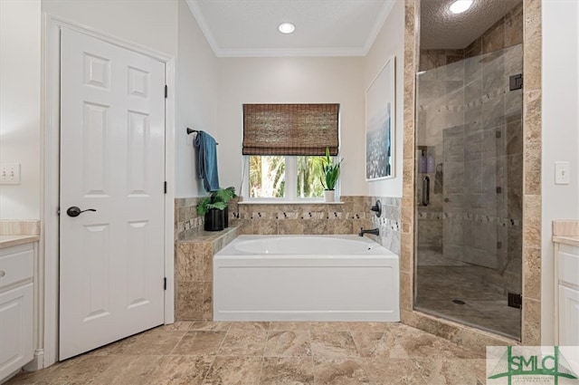 bathroom with plus walk in shower, vanity, ornamental molding, and tile flooring