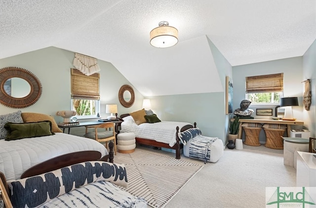 carpeted bedroom with lofted ceiling and a textured ceiling