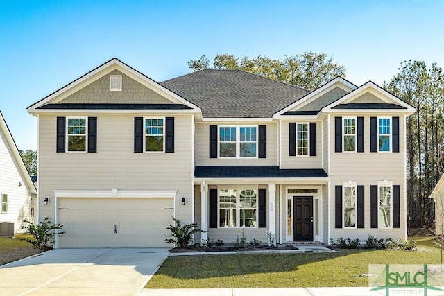 view of front of home featuring a garage, a front yard, and central air condition unit