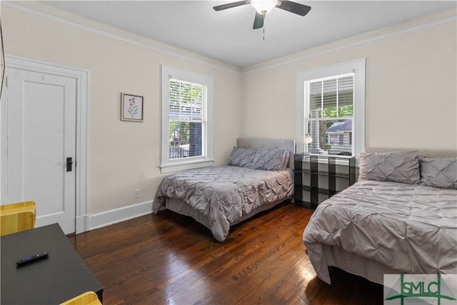 bedroom featuring ornamental molding, ceiling fan, and hardwood / wood-style floors