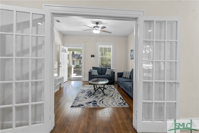 living room featuring ornamental molding, ceiling fan, french doors, and dark wood-type flooring