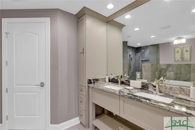 bathroom featuring vanity and separate shower and tub