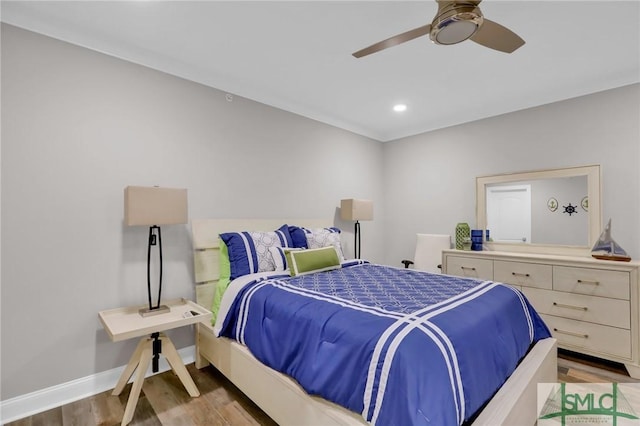 bedroom with ceiling fan and wood-type flooring