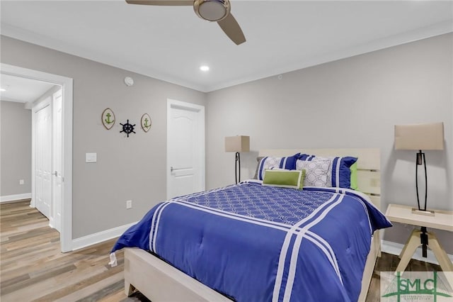 bedroom featuring hardwood / wood-style flooring and ceiling fan