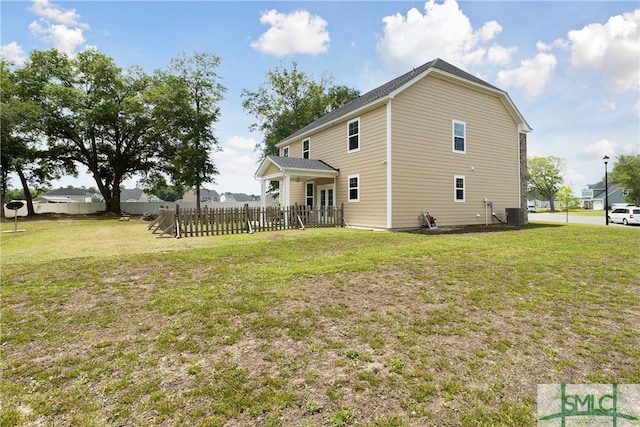 back of house with a yard