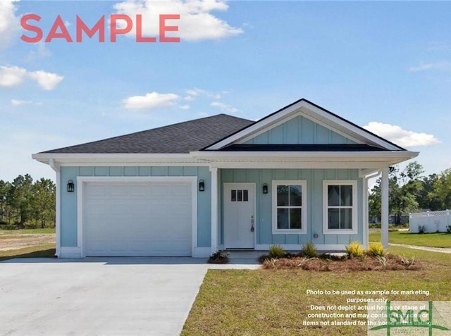 view of front of property featuring a garage and a front lawn