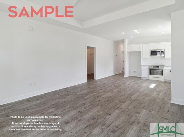 unfurnished living room with hardwood / wood-style floors