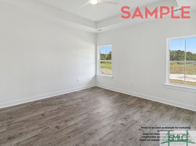 unfurnished room featuring hardwood / wood-style floors and ceiling fan