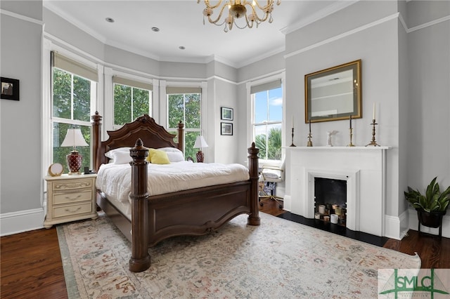 bedroom with hardwood / wood-style flooring, ornamental molding, a chandelier, and multiple windows