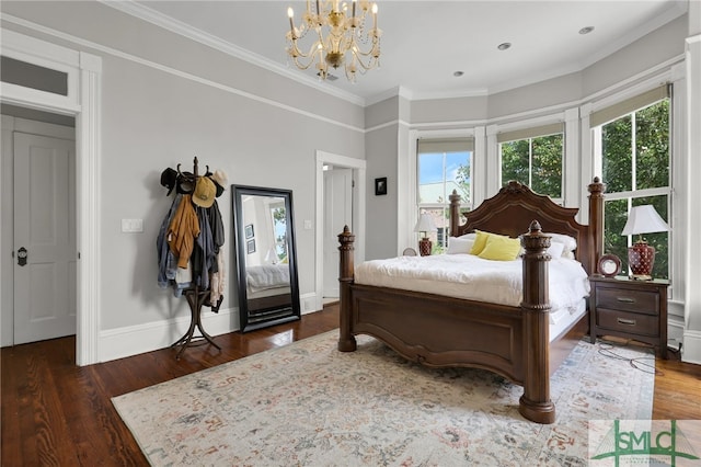 bedroom featuring dark wood-type flooring, a notable chandelier, and ornamental molding