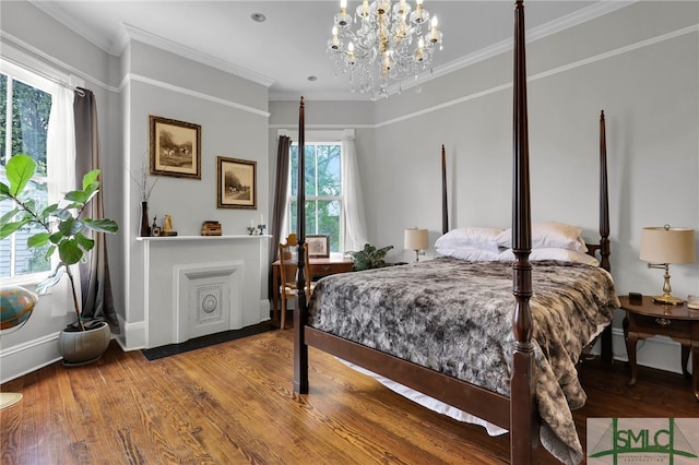 bedroom with ornamental molding, a notable chandelier, and hardwood / wood-style floors