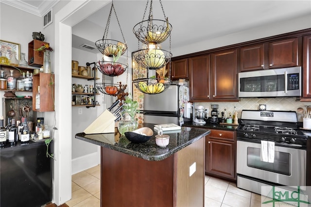 kitchen featuring a center island, tasteful backsplash, stainless steel appliances, and light tile floors