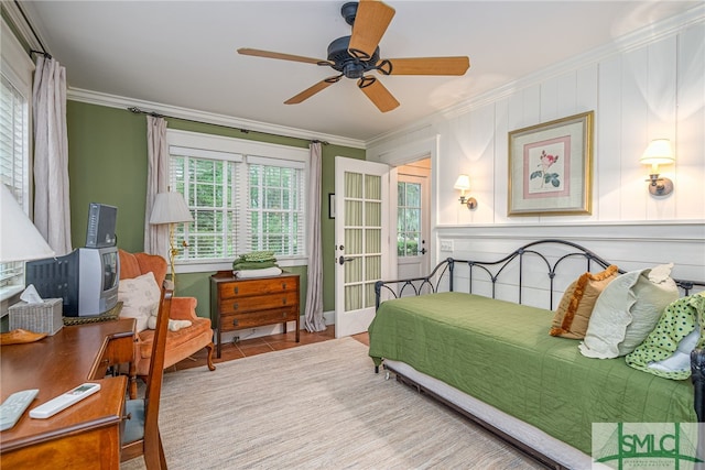 bedroom featuring ornamental molding and ceiling fan