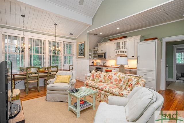 living room with wood ceiling, light hardwood / wood-style flooring, lofted ceiling with beams, and an inviting chandelier